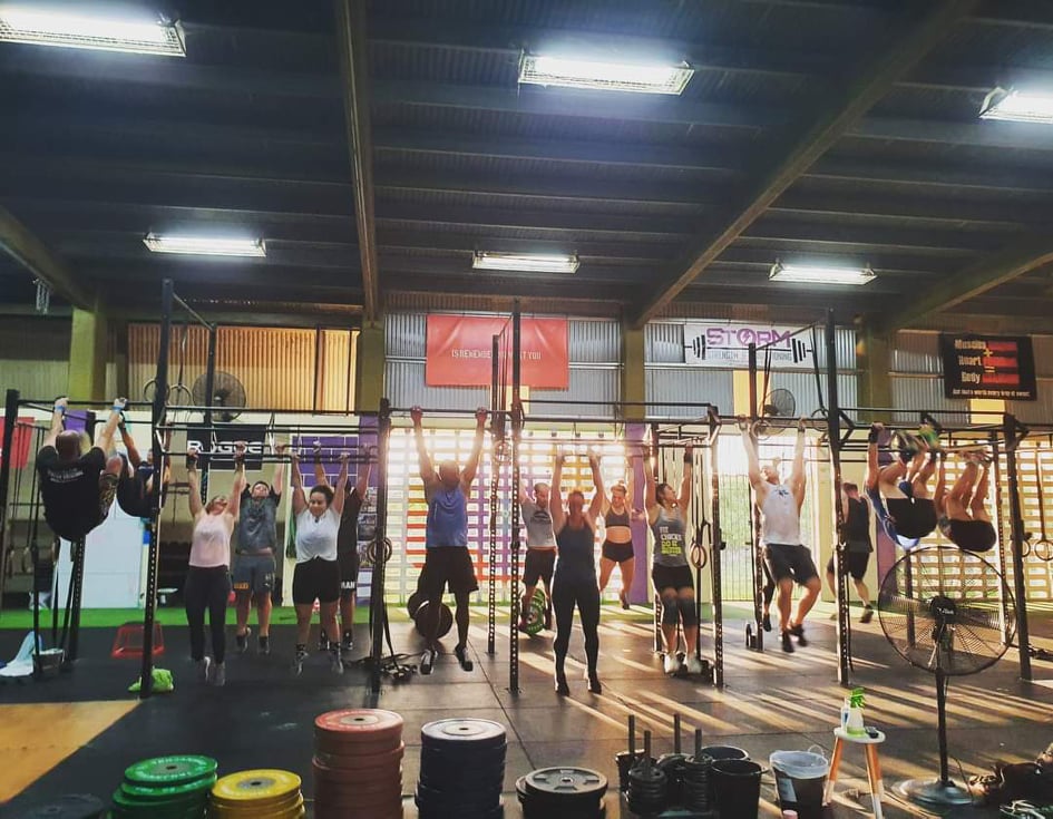 Members hanging out on the gym floor after training