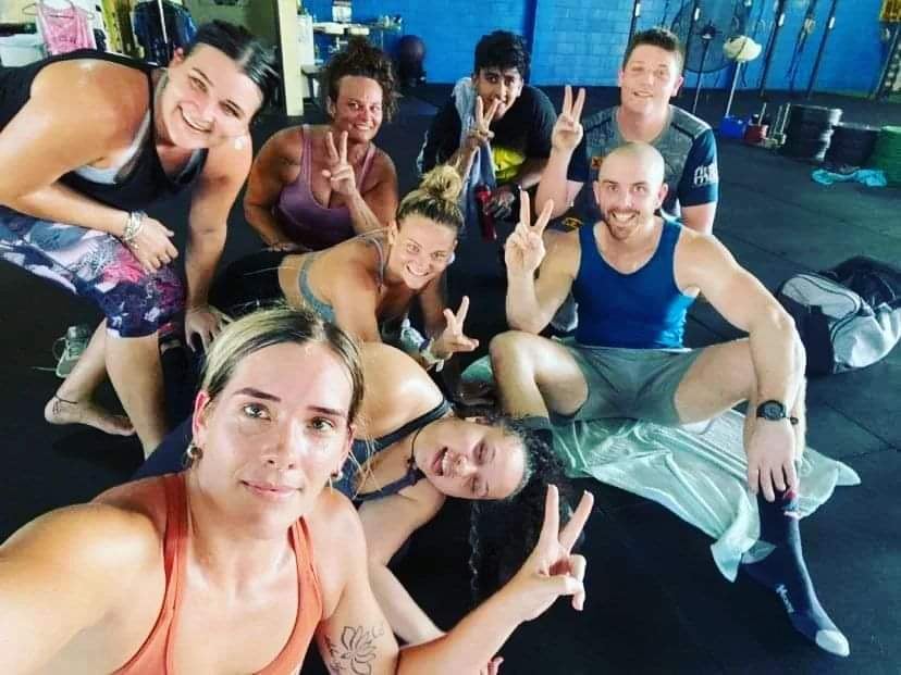 Members crowded together for a selfie after class